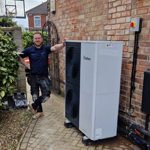 Engineer carrying out a heat pump service
