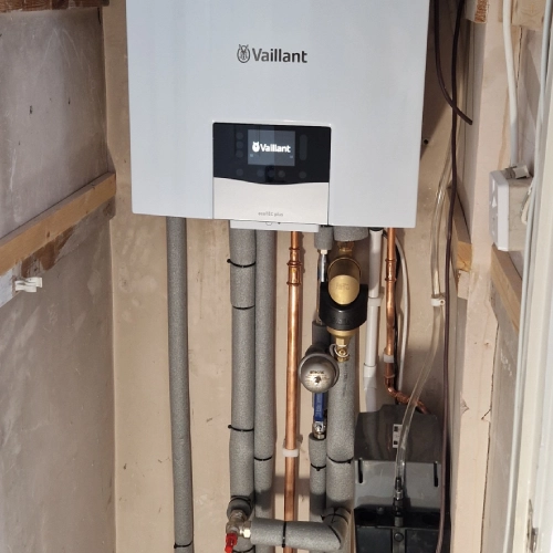 Engineer repairing boiler