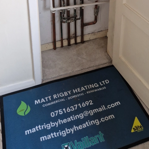 Engineer fitting a domestic gas appliance